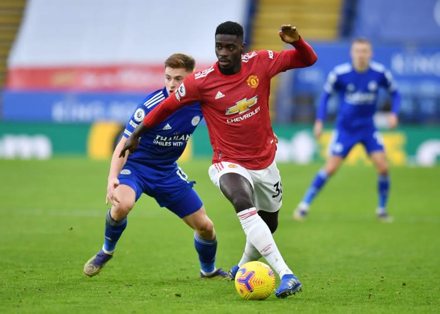 Soccer Football - Premier League - Leicester City v Manchester United - King Power Stadium, Leicester, Britain - December 26, 2020 Manchester United's Axel Tuanzebe in action with Leicester City's Harvey Barnes Pool via REUTERS/Glyn Kirk