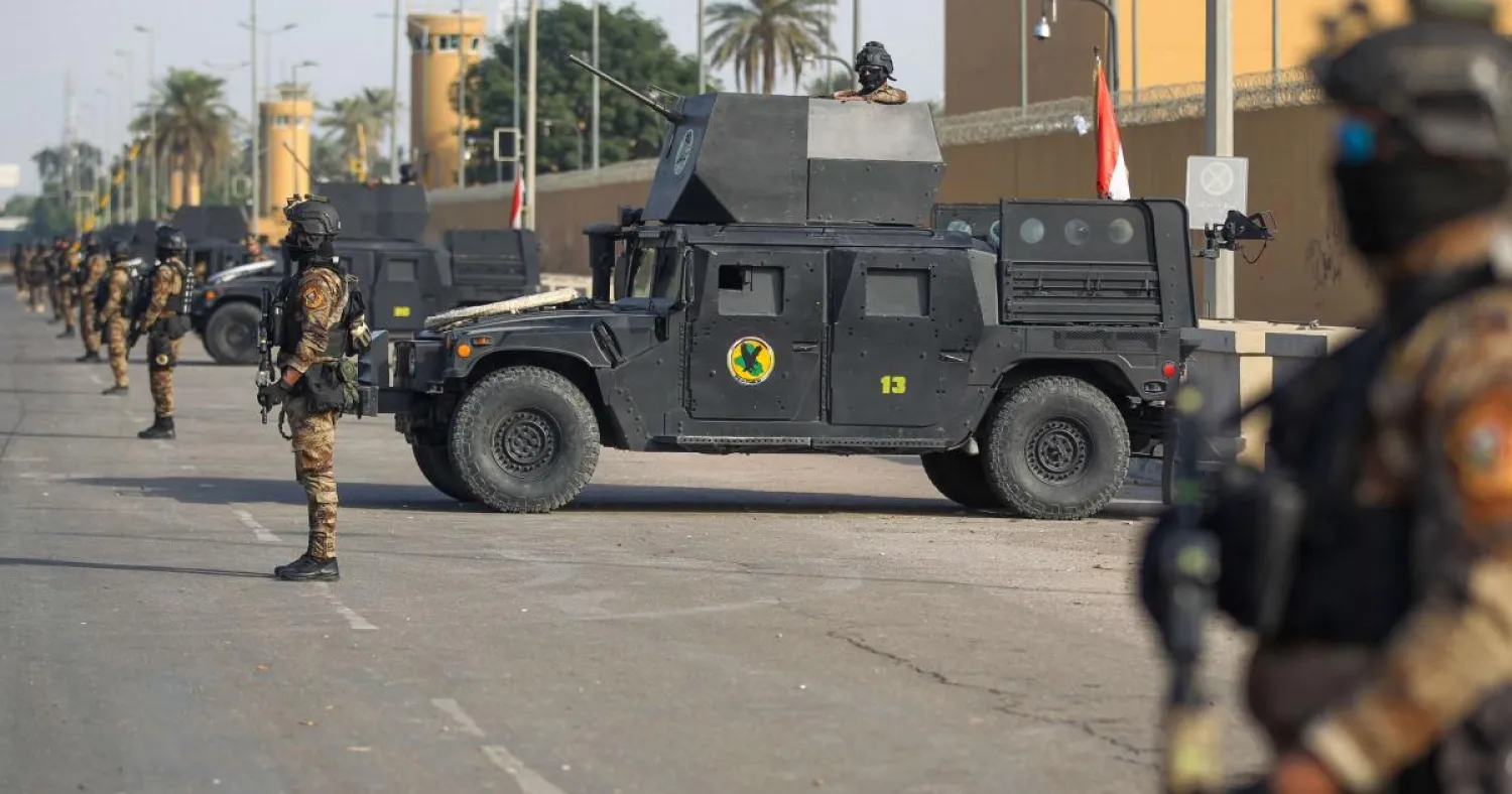 Iraqi counter-terrorism forces stand guard in front of the US Embassy in Baghdad, Iraq. (AFP file photo)