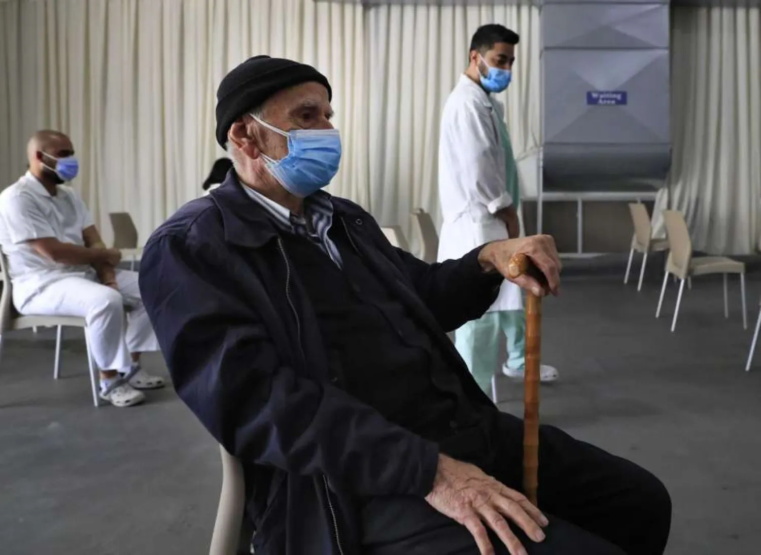 A man waits his turn to receive the Pfizer-BioNTech COVID-19 vaccine during a nationwide vaccination campaign, at the Saint George Hospital, in Beirut, Lebanon, Tuesday, Feb. 16, 2021. 7(AP Photo/Hussein Malla)