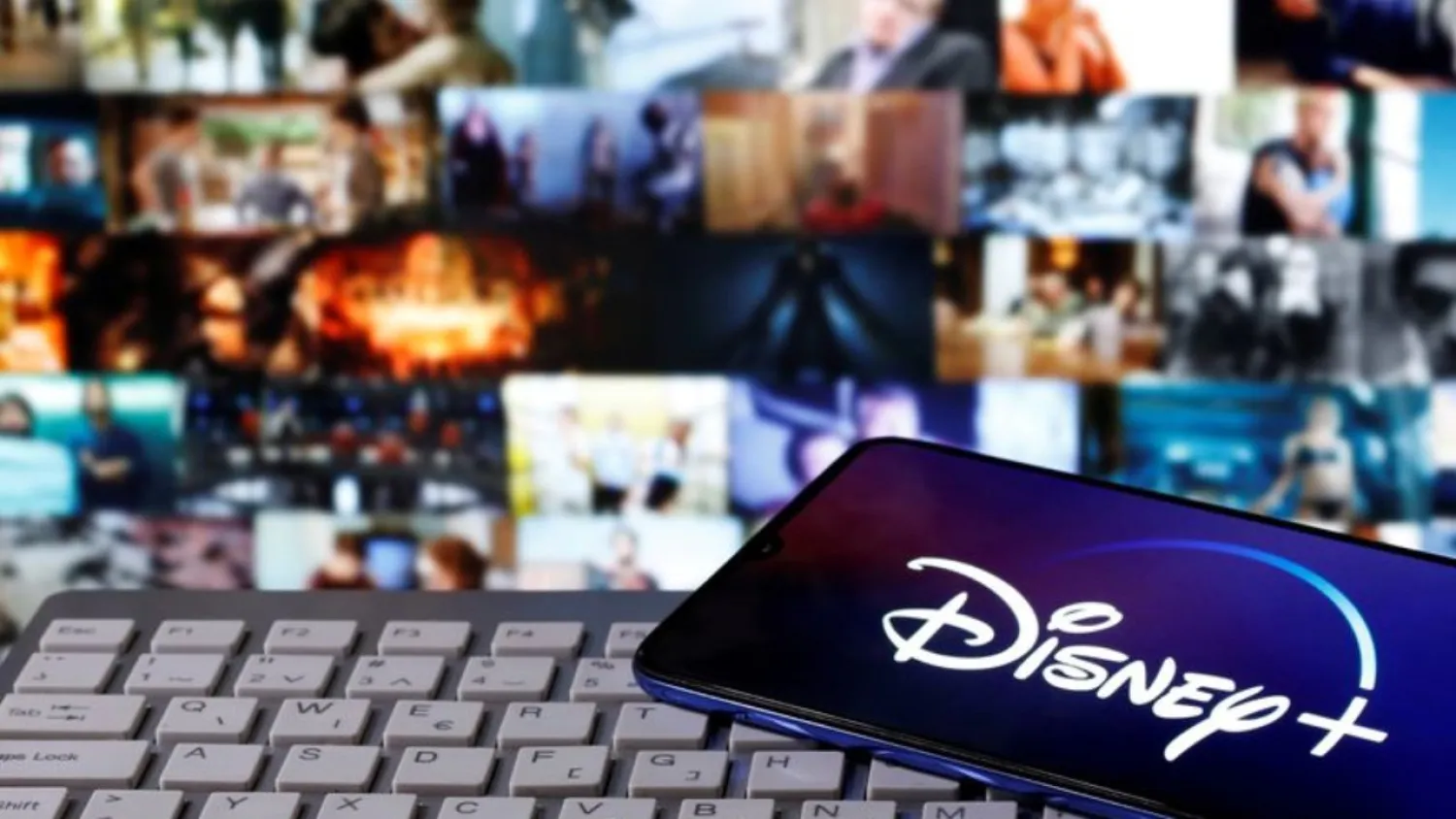 A smartphone with displayed "Disney" logo is seen on the keyboard in this illustration taken March 24, 2020. (Reuters)