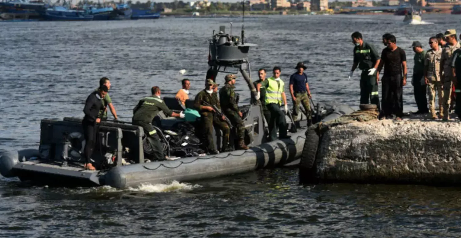 Egyptian medics arrive on a boat carrying bodies of migrants, during a search operation after a boat capsized in the Mediterranean, off the Egyptian coast on September 22, 2016. AFP file photo