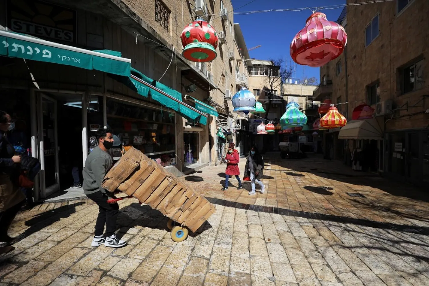 Israel is giving a "symbolic" amount of surplus COVID-19 vaccines to the Palestinians and to several countries. (Reuters)