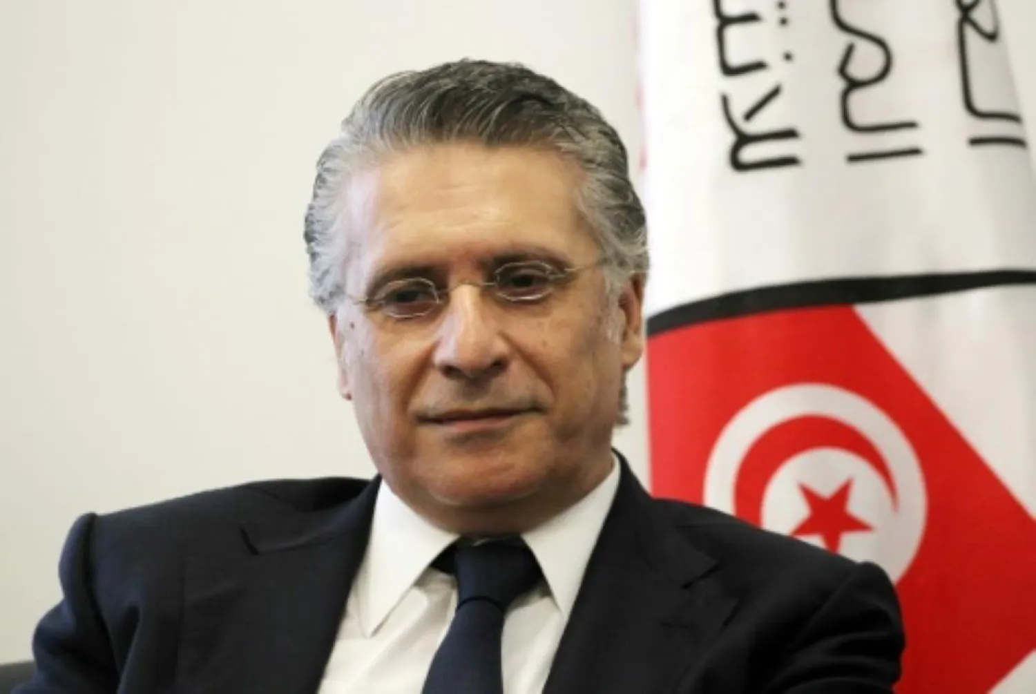 Nabil Karoui, Tunisian media magnate and would-be presidential candidate, is pictured after registering his candidacy to Tunisia's electoral commission in the capital Tunis on August 2, 2019. | AFP 