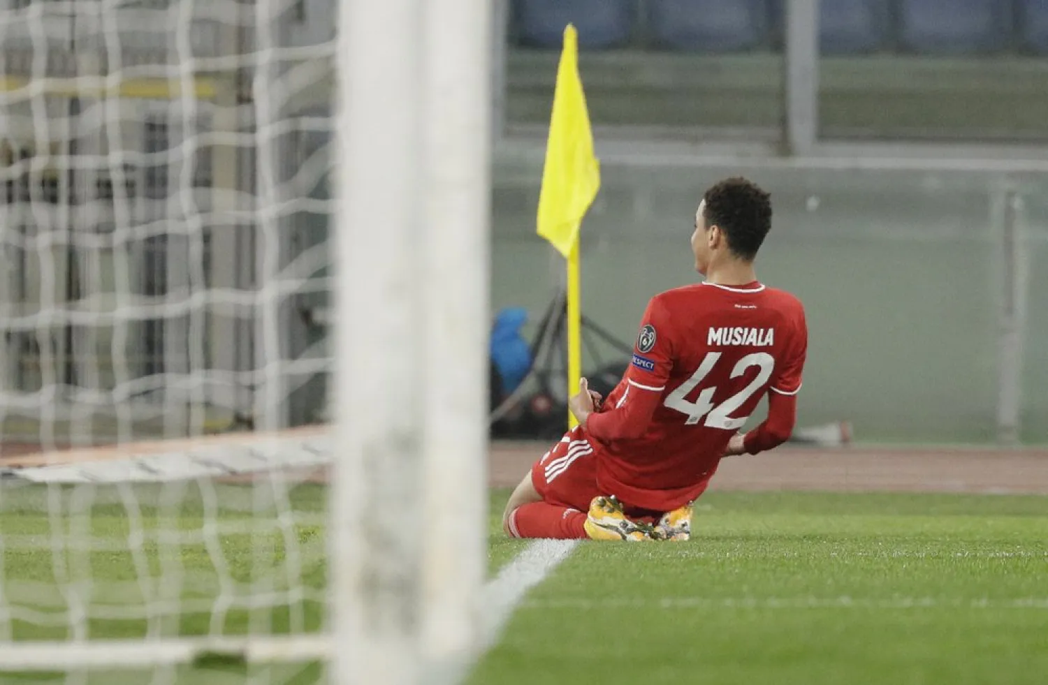 Bayern's Jamal Musiala celebrates after scoring his side's second goal during the Champions League match against Lazio at the Olympic stadium in Rome, Feb. 23, 2021. (AP)