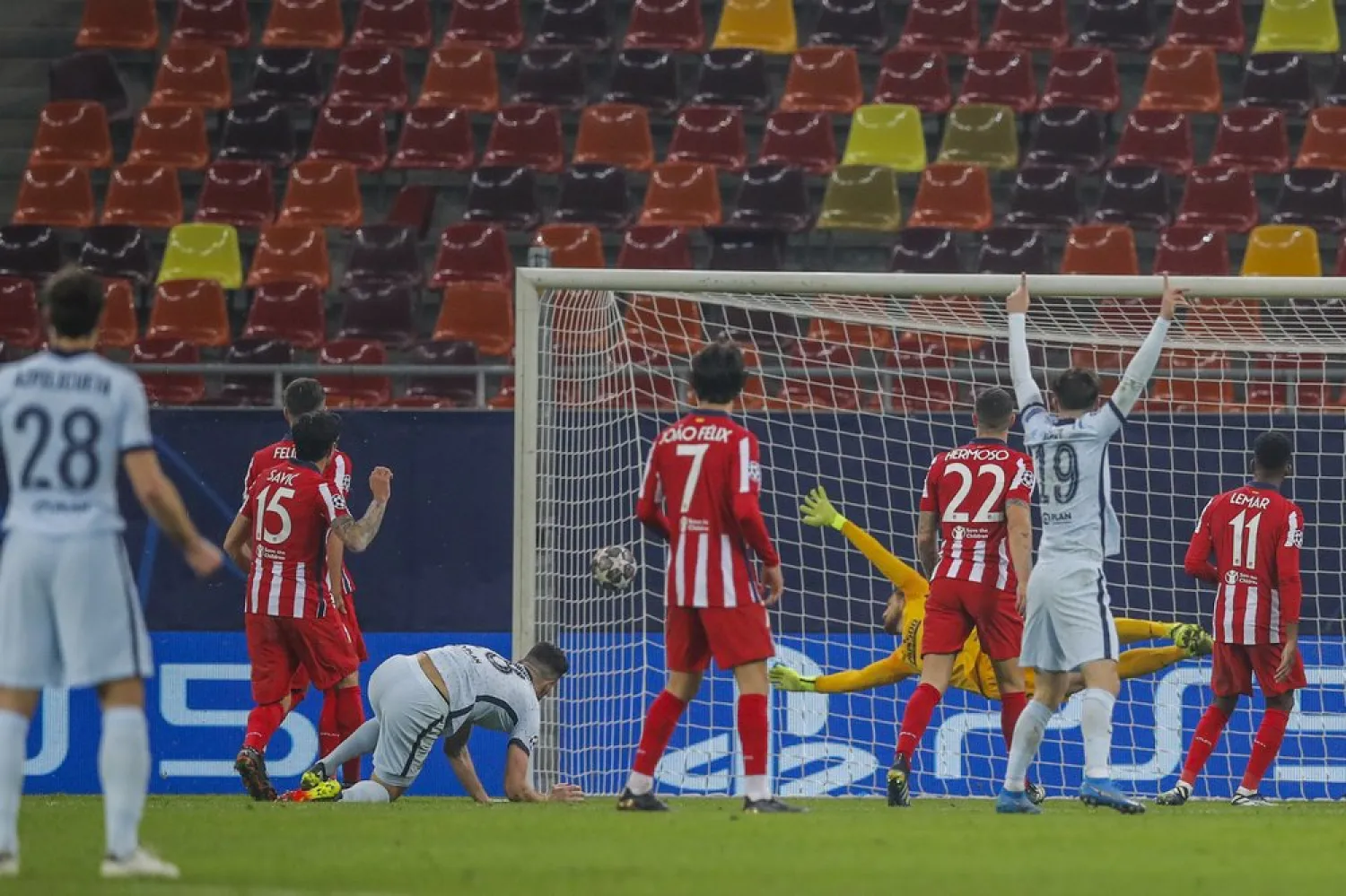 Chelsea's Olivier Giroud, center left, scores the opening goal during the Champions League match against Atletico Madrid at the National Arena stadium in Bucharest, Romania, Feb. 23, 2021. (AP)