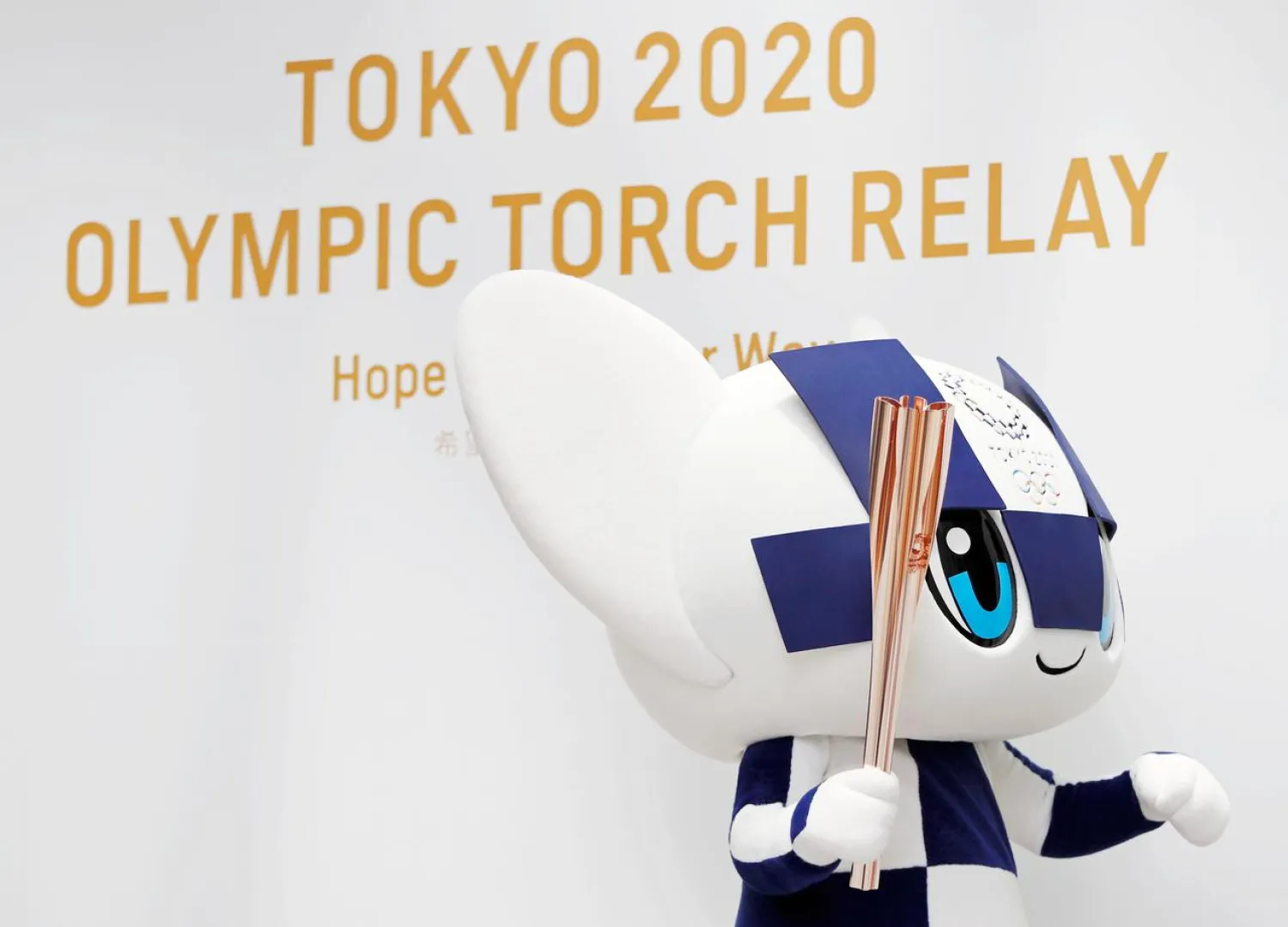 FILE PHOTO: Tokyo 2020 Olympic Games mascot Miraitowa holds the torch of the Tokyo 2020 Olympic Games. REUTERS/Issei Kato/File Photo