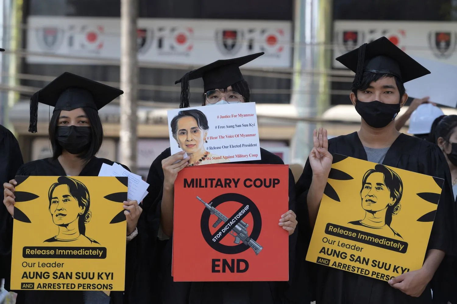 Demonstrators hold signs during a protest against the military coup and demanding the release of elected leader Aung San Suu Kyi, in Yangon. Reuters