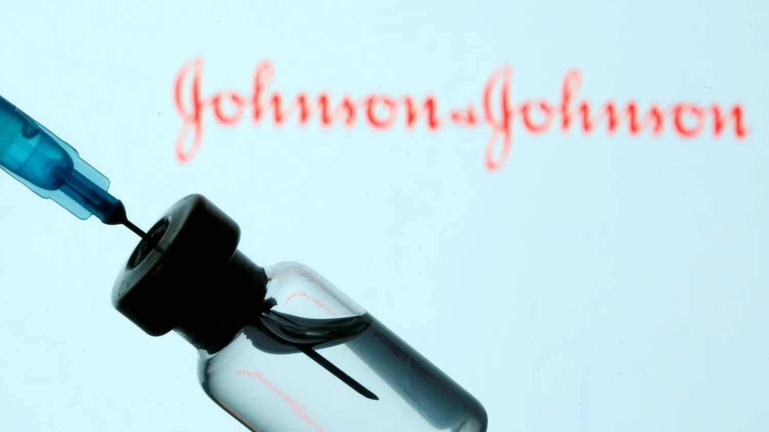 FILE PHOTO: A vial and syringe are seen in front of a displayed Johnson & Johnson logo in this illustration taken January 11, 2021. REUTERS/Dado Ruvic/Illustration/File Photo