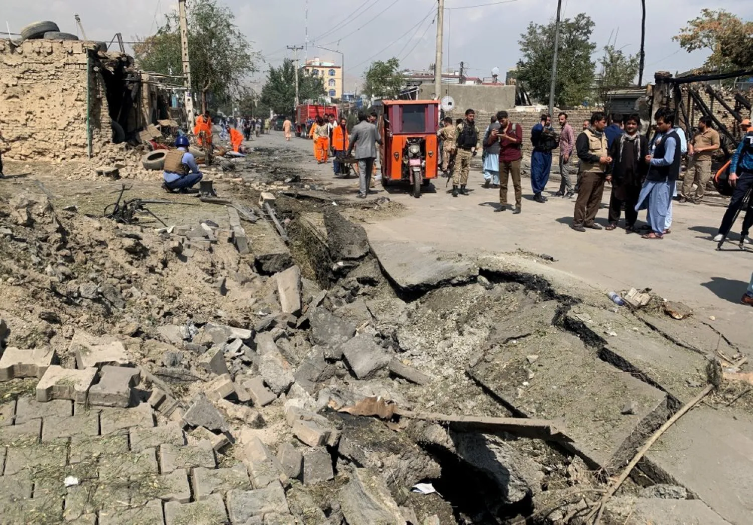 Afghan security personnel and Municipality workers work at the site of an explosion in Kabul, Afghanistan, Wednesday, Sept. 9, 2020.(AP Photo/Rahmat Gul)
