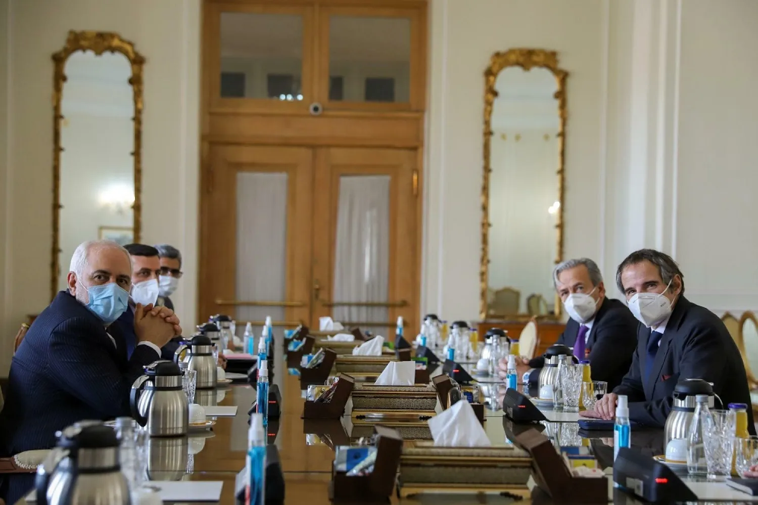 Iranian FM Mohammad Javad Zarif (L) meets with IAEA Director General Rafael Grossi (R) in Tehran, Iran, February 21, 2021. (WANA via Reuters)