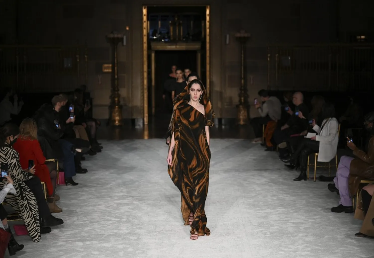 Models walk the runway at the Christian Siriano Fall/Winter 2021 at Gotham Hall during New York Fashion Week on Thursday, Feb. 25, 2021, in New York. (AP)