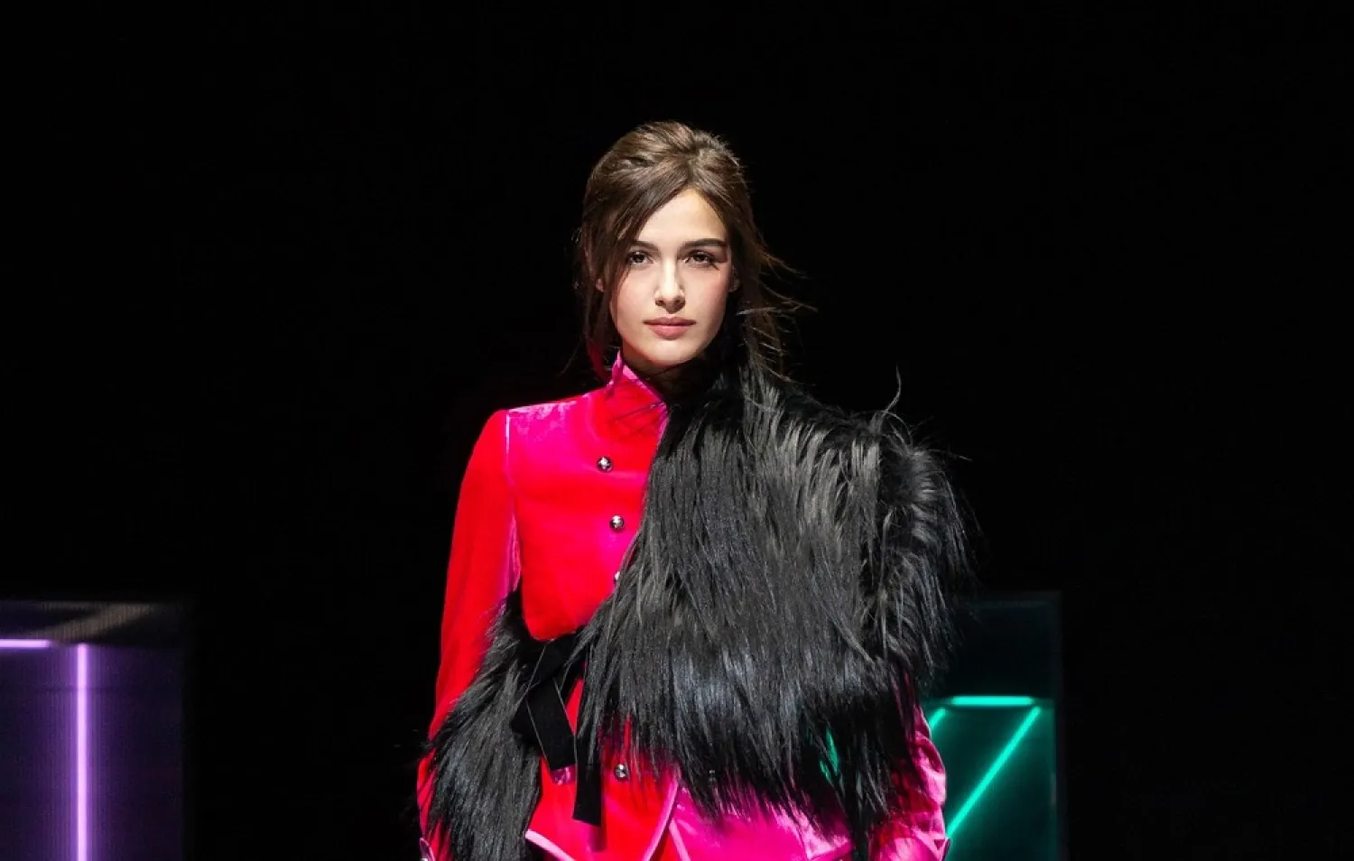 The veteran designer presented plenty of hot pink and purple creations, high-waisted trousers and chunky jewelry. (Armani)