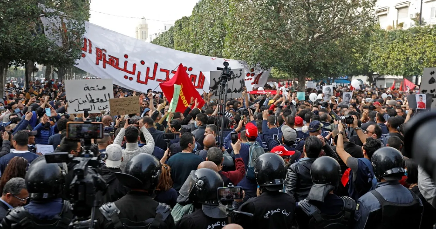 Demonstrators attend a protest to mark the anniversary of a prominent activist's death and against allegations of police abuse, in Tunis, Tunisia, Feb. 6, 2021. (Reuters)