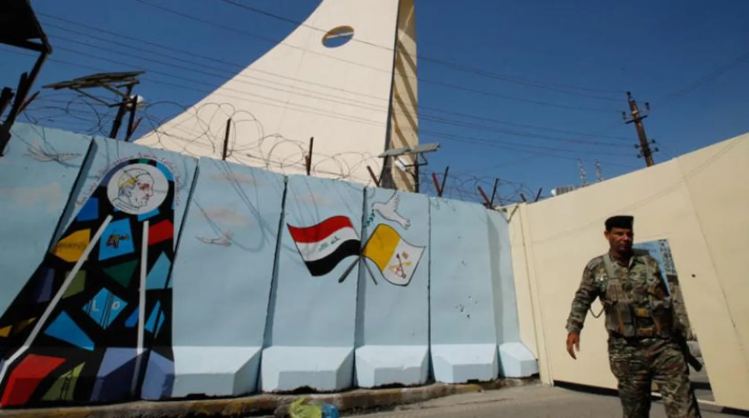 An Iraqi army soldier stands guard by a concrete wall placed by Iraqi security forces to surround the Our Lady of Salvation Church during preparations for the Pope's visit in Baghdad, Iraq, Friday, Feb. 26, 2021. (AP/Photo/Hadi Mizban)
