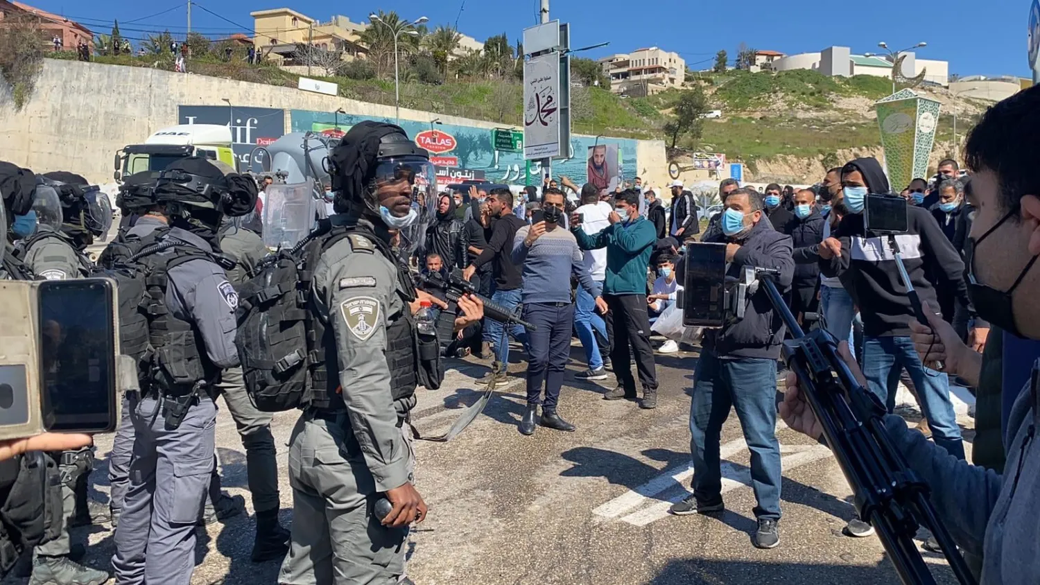 Israeli police use heavy force to disperse dozens of Palestinian anti-crime protesters in Umm al-Fahm, February 26, 2021 (WAFA)