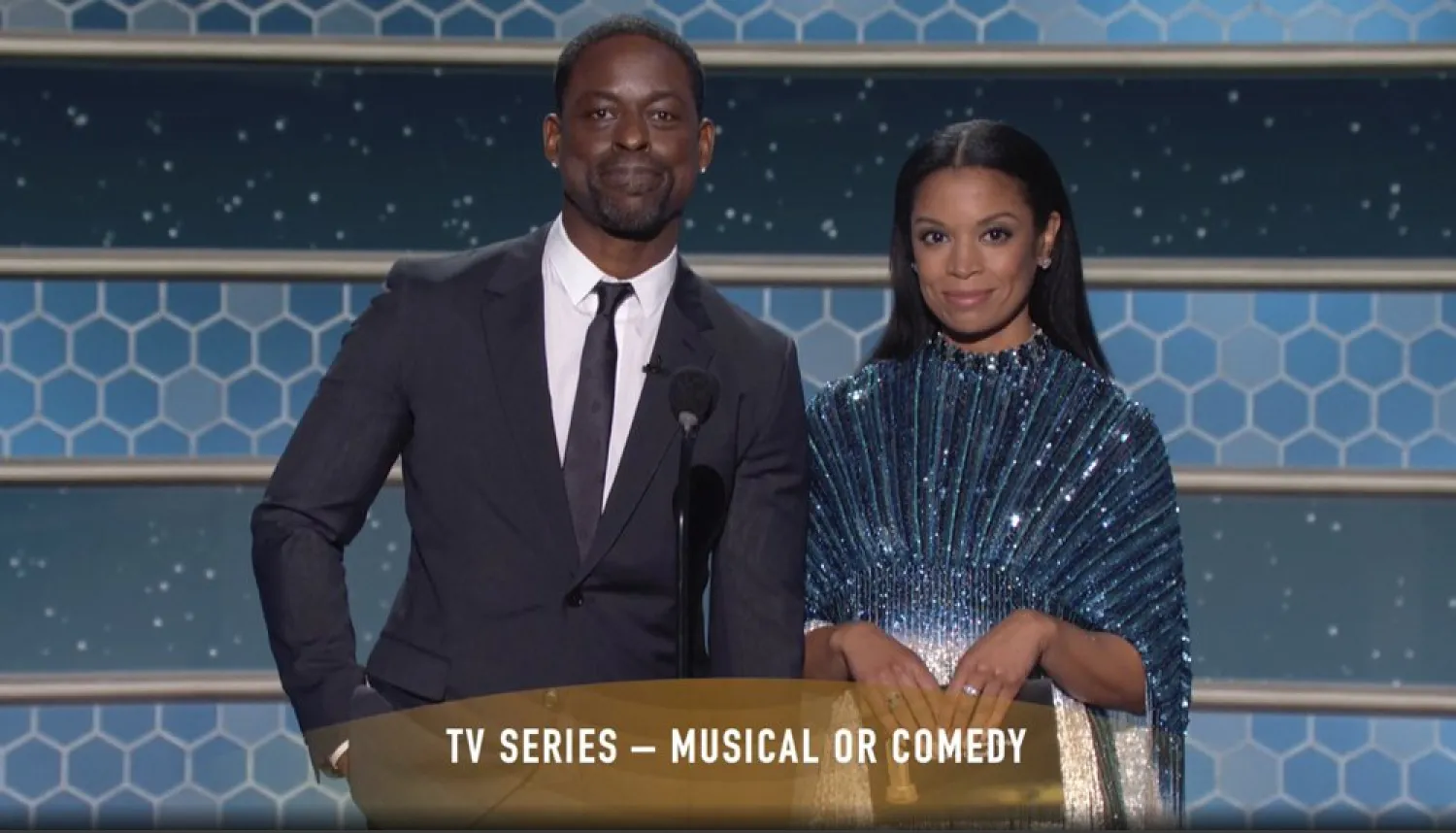 In this video grab issued Sunday, Feb. 28, 2021, by NBC, Sterling K. Brown, left, and Susan Kelechi Watson present the award for best television series, musical or comedy, at the Golden Globe Awards. (NBC via AP)
