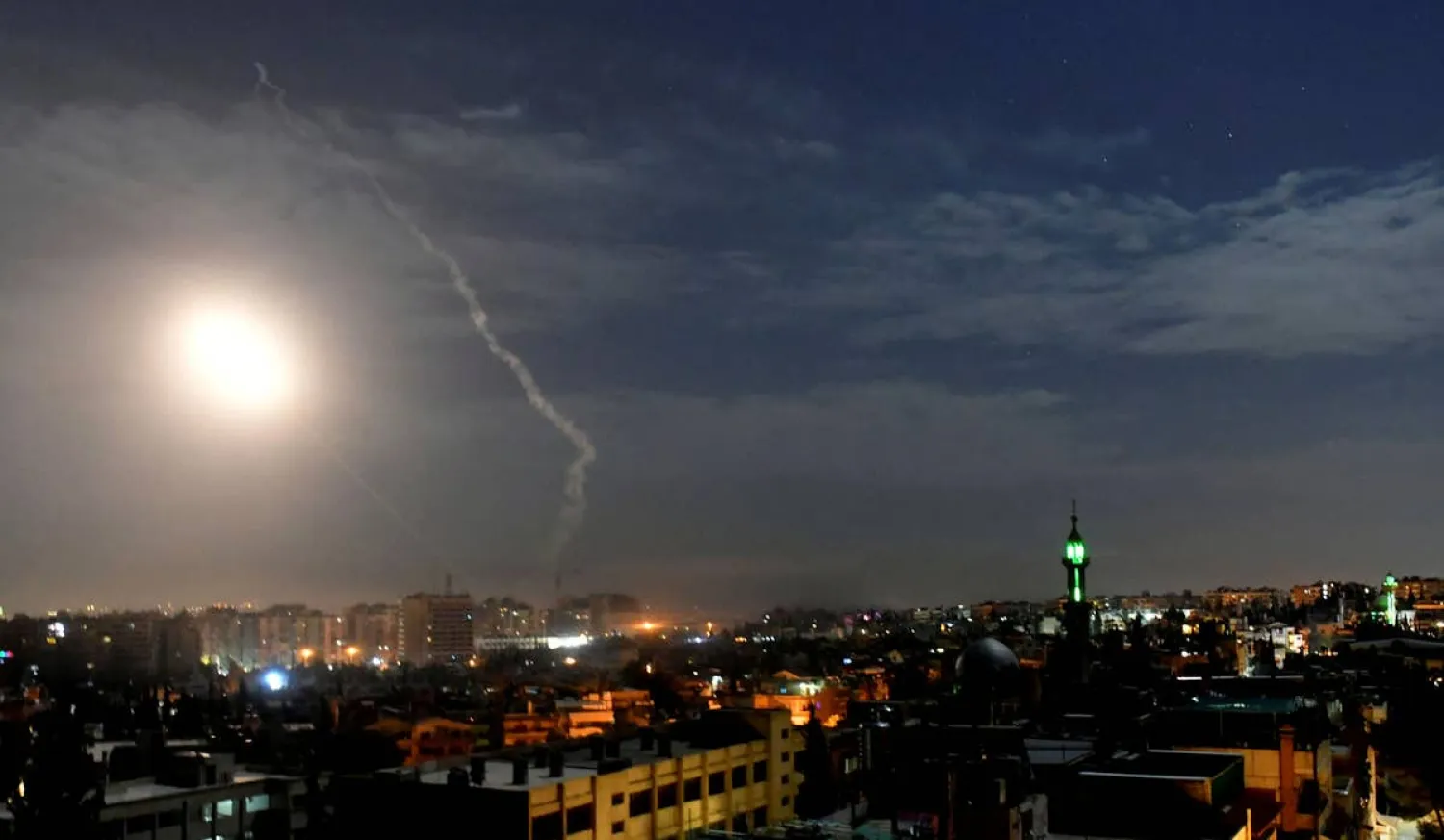 Missiles flying into the sky in Damascus near its international airport, two years ago. (AP) 