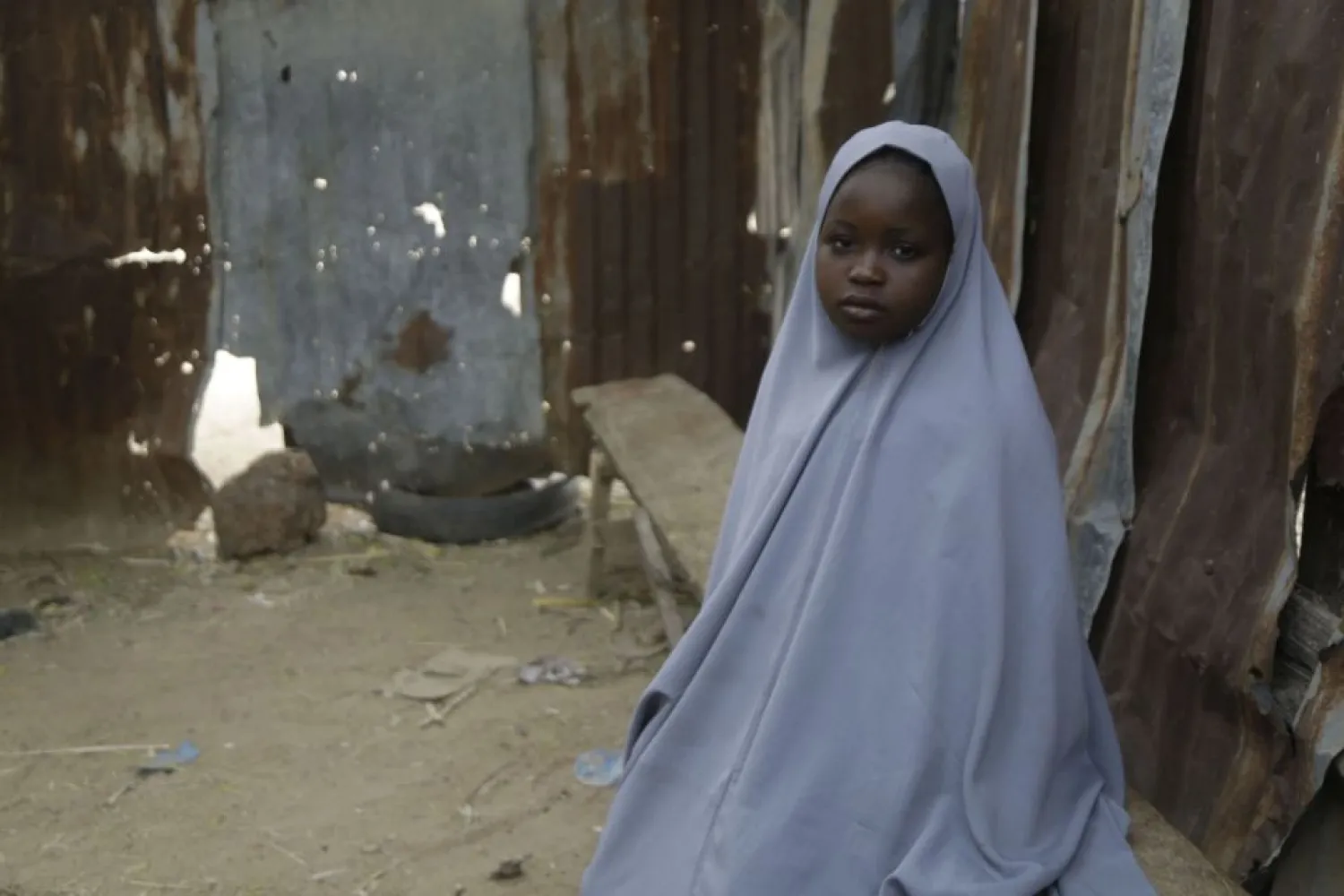 Student Amtallahi Lawal, 11, who hid under her bed and managed to escape when gunmen abducted more than 300 girls from her boarding school on Friday, recounts her ordeal at her house in Jangebe town, Zamfara state, northern Nigeria, Monday, March 1, 2021. (AP Photo/Sunday Alamba)