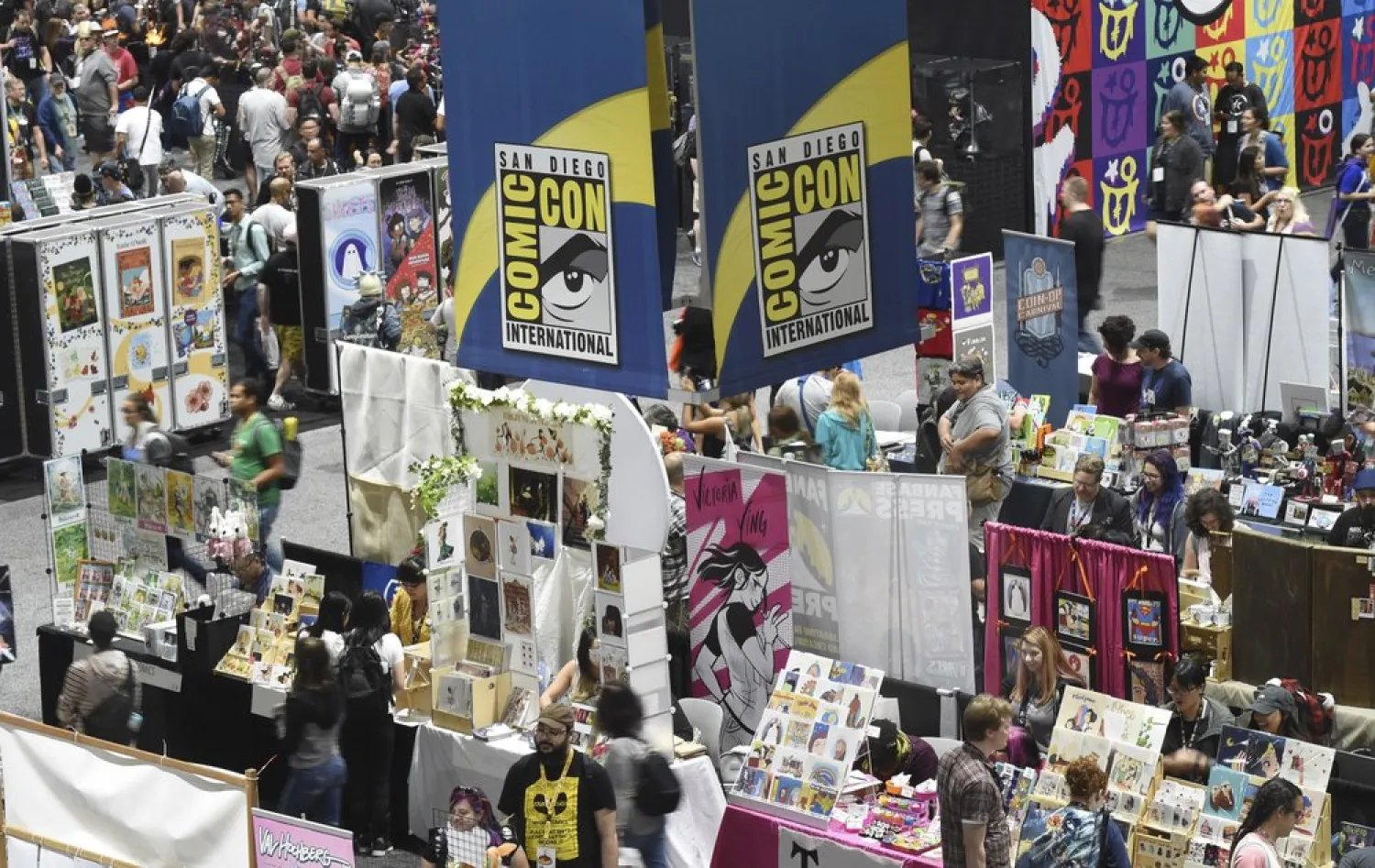 Comic-Con attendees walk the convention center floor during preview night at Comic-Con International on July 17, 2019, in San Diego, Calif. (AP)