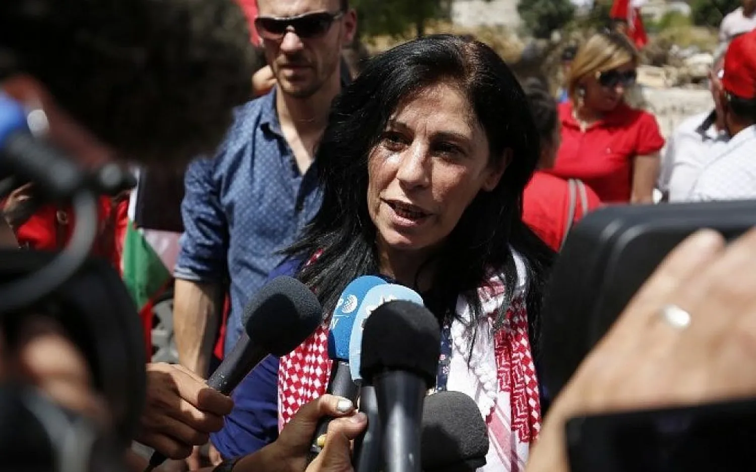 Khalida Jarrar greets speaks to reporters in her hometown, the West Bank city of Ramallah, following her release from an Israeli jail on June 3, 2016. (AFP)