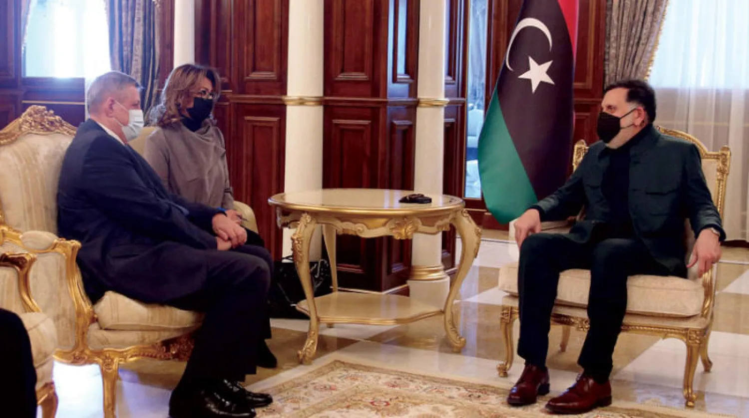 صورة من لقاء سابق بين السراج ودبيبة بطرابلس في فبراير الماضي (أ.ف.ب)