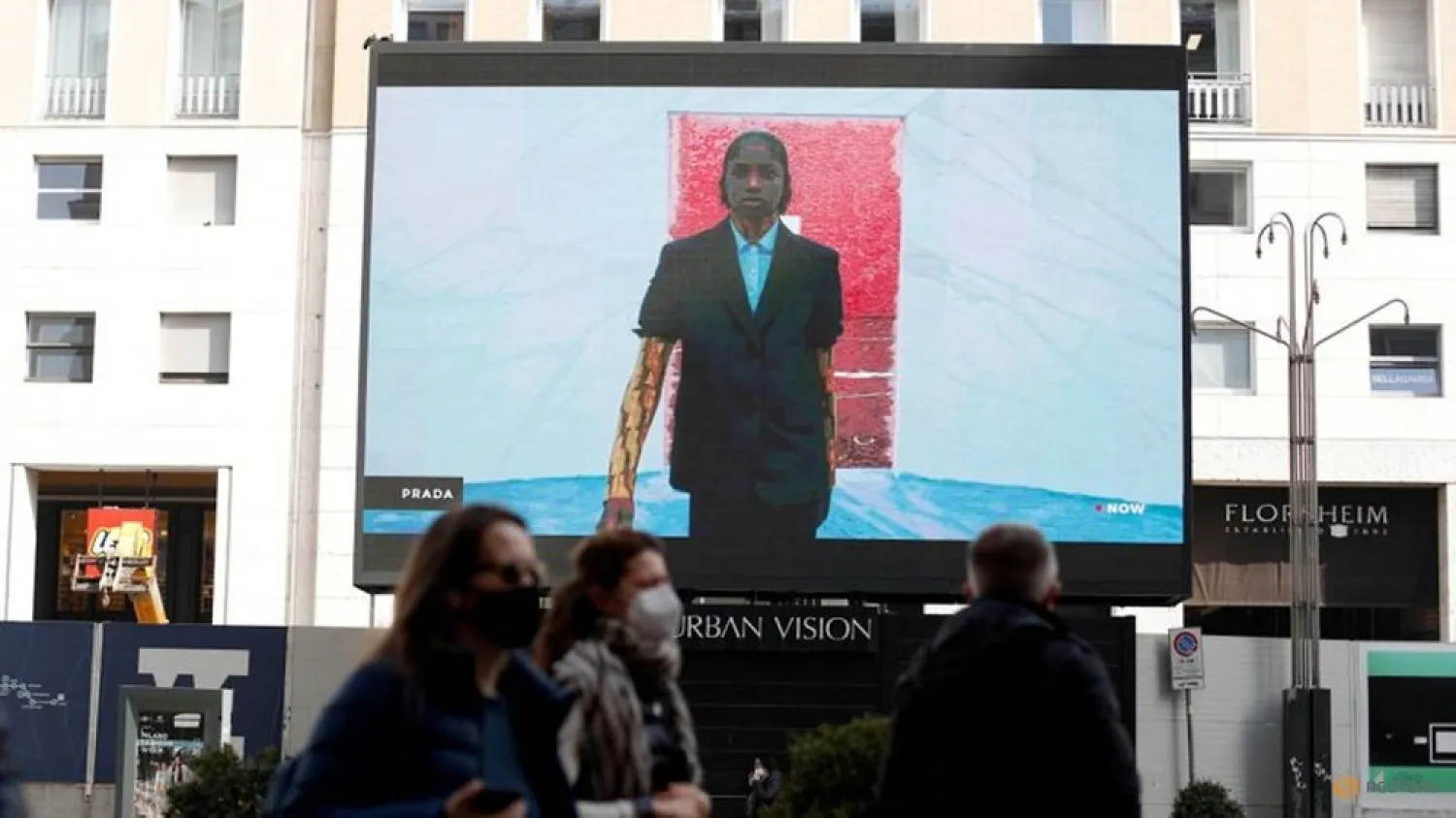 A giant screen set up in San Babila square streams the Prada Fall/Winter 2021/2022 digital show during Fashion Week in Milan, Italy, February 25, 2021. (Reuters)