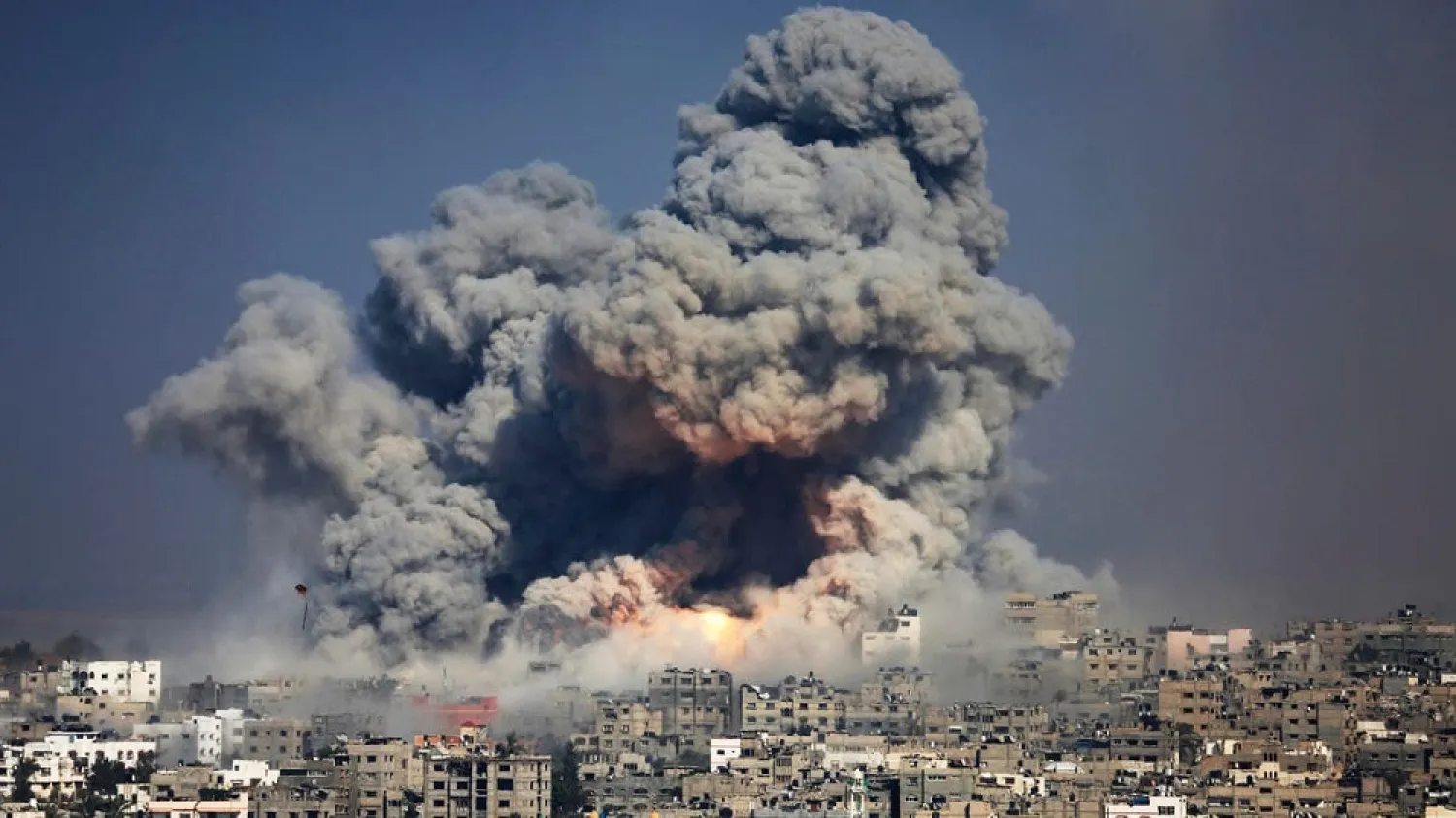 In this July 29, 2014 file photo, smoke and fire from an Israeli strike rise over Gaza City. (AP)