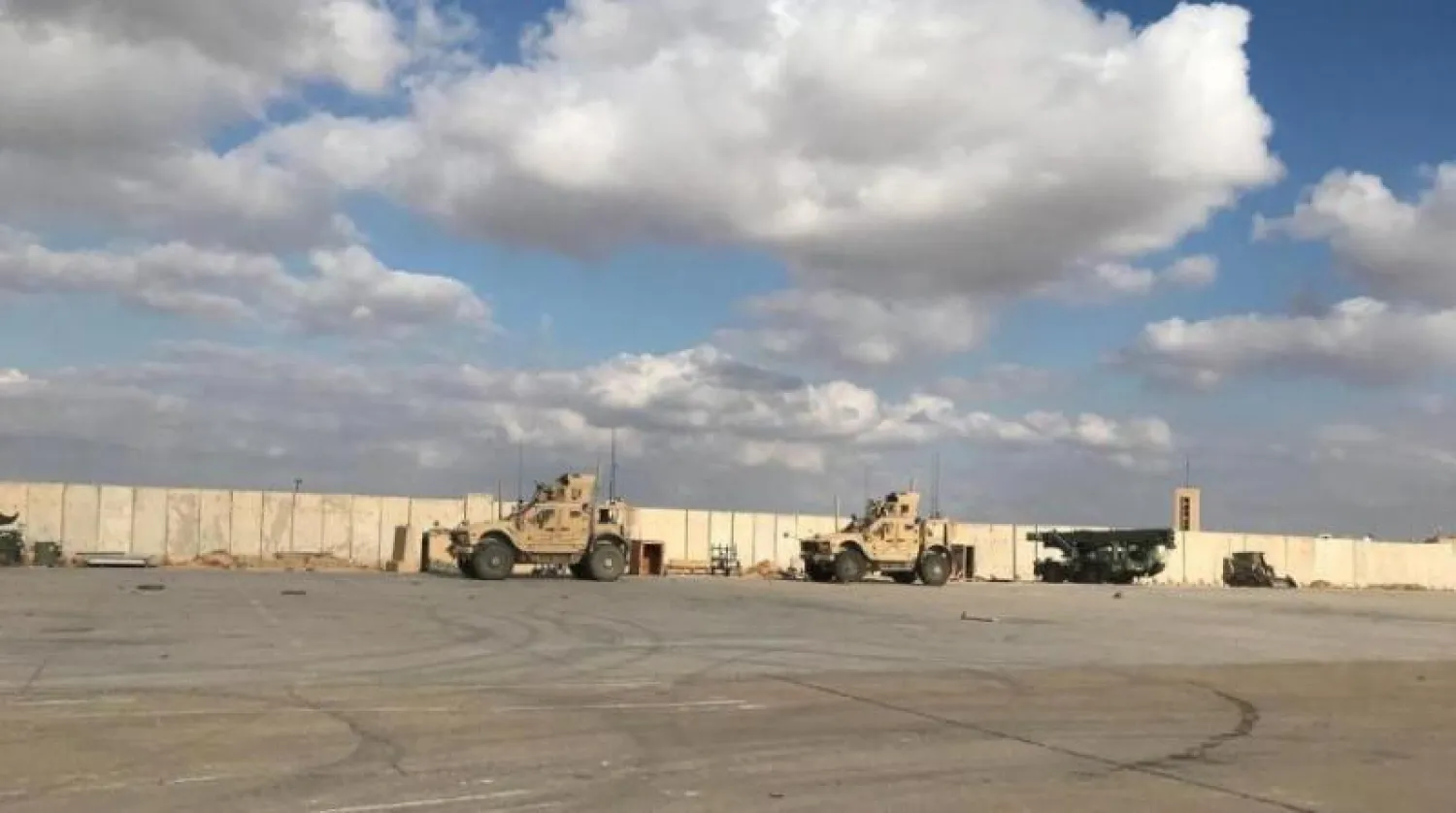 عربات عسكرية أميركية في قاعدة عين الأسد الجوية بالعراق (رويترز)