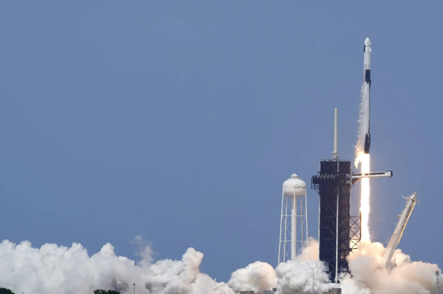 A SpaceX Falcon 9, with NASA astronauts Doug Hurley and Bob
Behnken in the Crew Dragon capsule, lifts off from Pad 39-A at the
Kennedy Space Center in Cape Canaveral, Fla., Saturday, May 30, 2020.
(AP Photo)