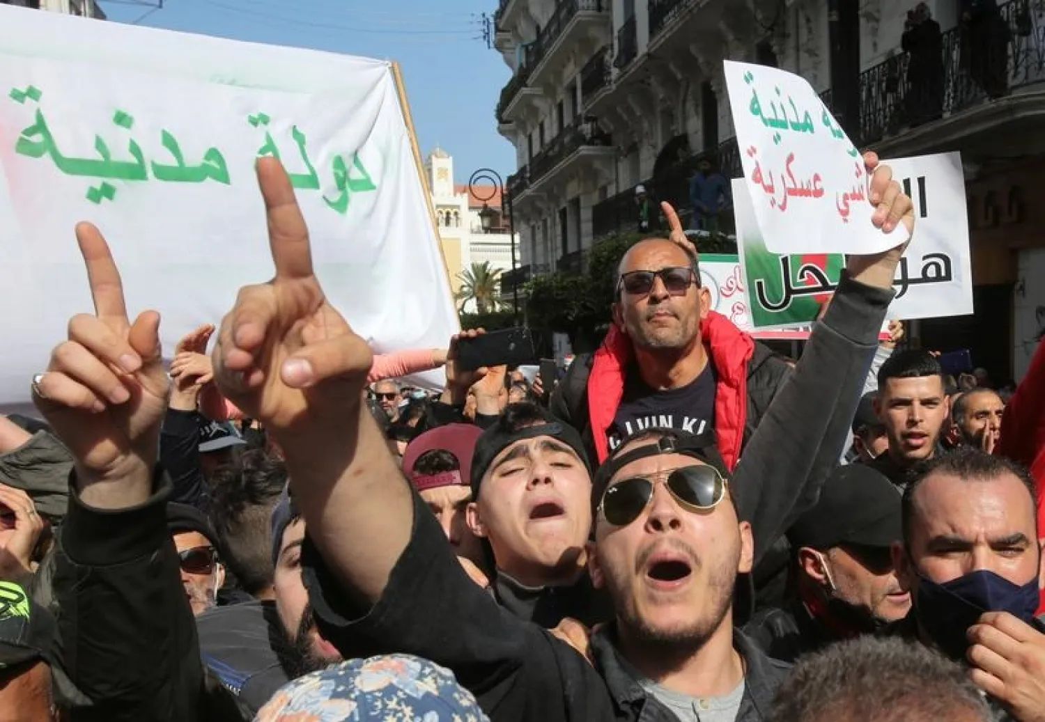 Demonstrators gesture and shout slogans during a protest demanding political change, in Algiers, Algeria March 5, 2021. (Reuters)