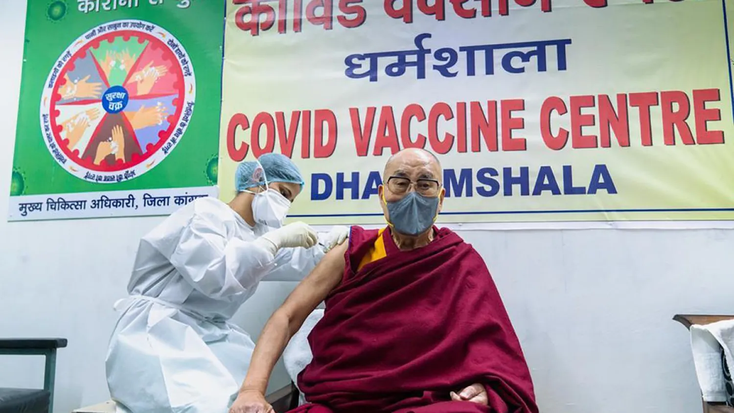 This photograph provided by Office of his Holiness the Dalai Lama shows the Tibetan spiritual leader receiving a shot of the COVID-19 vaccine at Zonal Hospital in Dharmsala, India, Saturday, March 6, 2021. (Office of his holiness the Dalai Lama via AP)