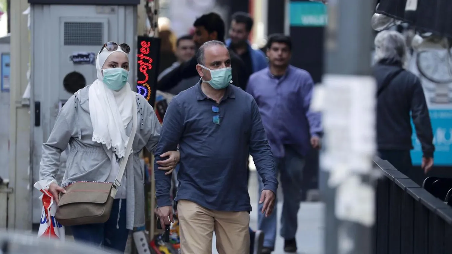  People wear face masks on the streets of Beirut, Lebanon. Courtesy: AFP  
