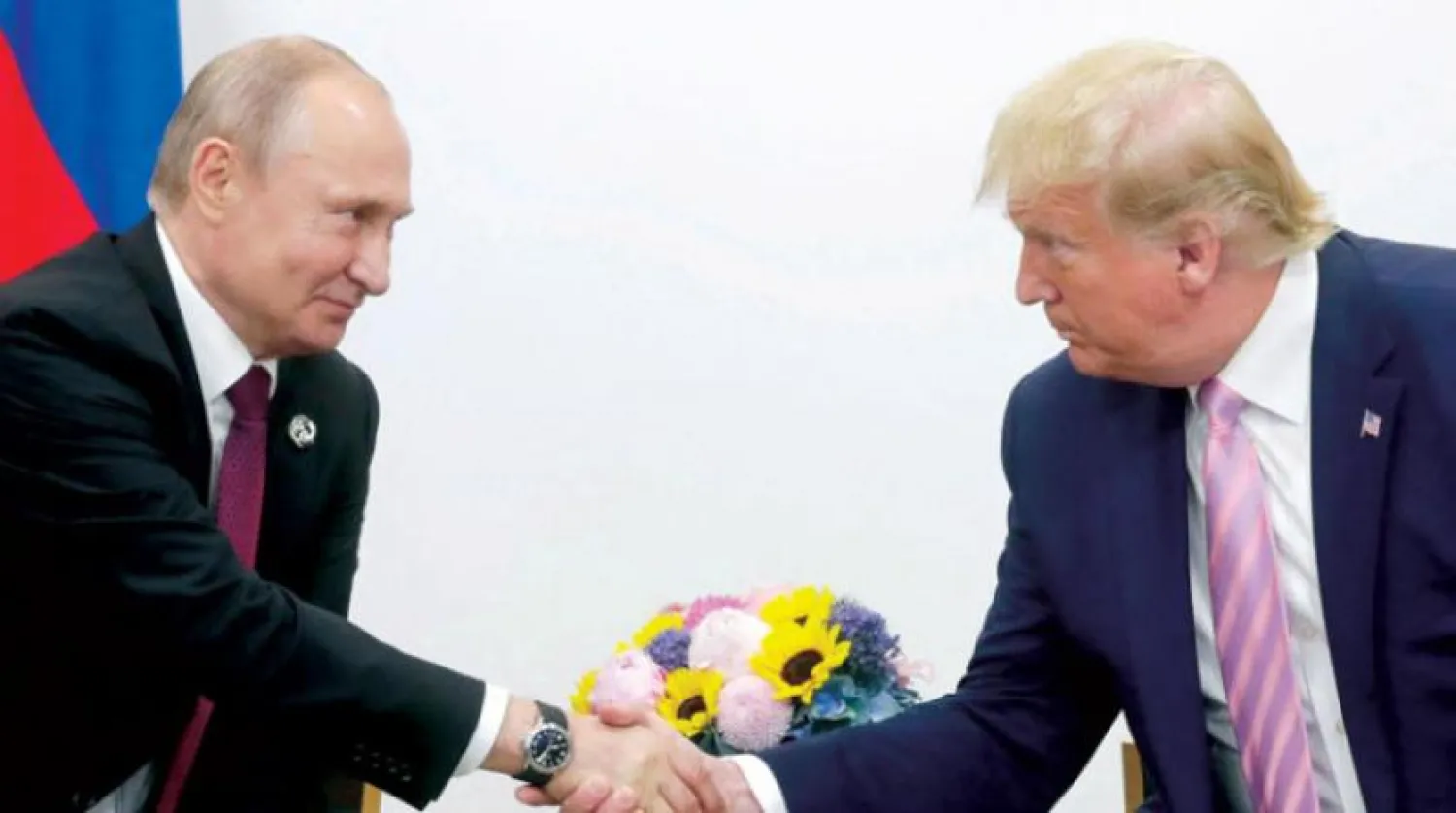 Eski ABD Başkanı Donald Trump ve Rusya Devlet Başkanı Vladimir Putin, Haziran 2019'da Japonya'nın Osaka kentinde G20 Zirvesi'nin oturum aralarında bir araya gelmişlerdi (Getty)
