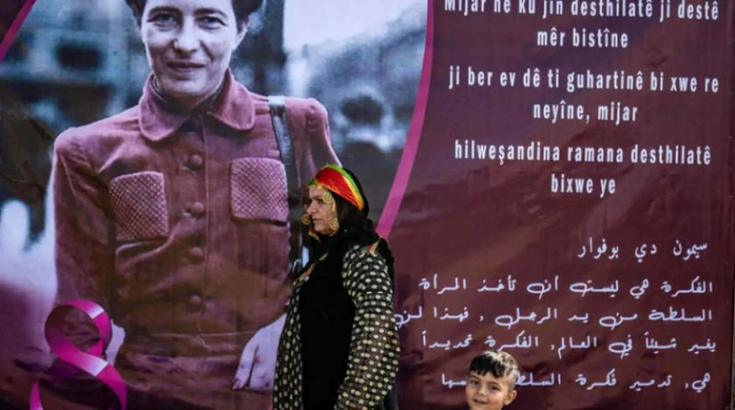 Kurdish Syrian women take part in Women's Day celebration in the Syria's northeastern city of Qamishli on March 6, 2021. (Photo by Delil SOULEIMAN / AFP)