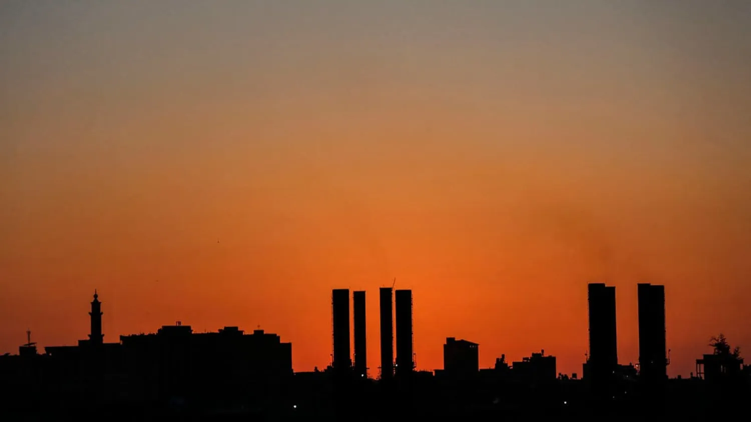 A picture shows a power generating facility in the middle of the Gaza Strip during sunset on August 17, 2020 as Gaza's electricity authority announced that more service cuts would be implemented from due to lack of fuel. Israel halted the import of fuel into the Gaza Strip, the latest punitive measure over a wave of airborne fire bombs from the Palestinian territory. (File photo: AFP)
