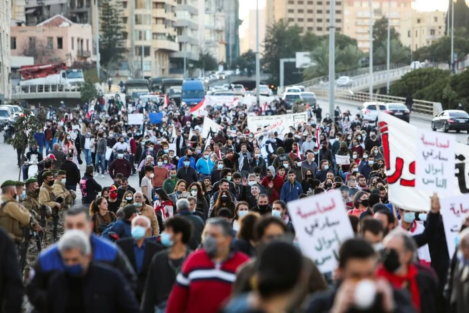 Demonstrators attend a protest against the fall in Lebanese pound currency and mounting economic hardships, in Beirut, Lebanon March 12, 2021. (Reuters)