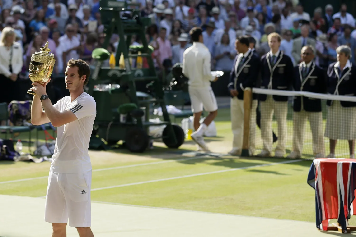 FILE - In this July 7, 2013 photo  Andy Murray of Britain poses with the trophy after defeating Novak Djokovic of Serbia in the men's singles final match at the All England Lawn Tennis Championships in Wimbledon, London. (AP Photo/Alastair Grant, File)
