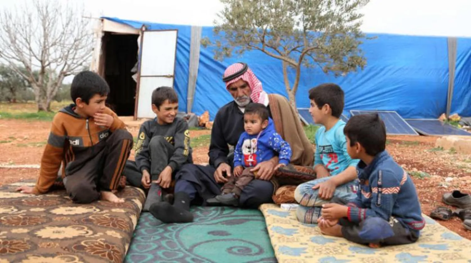  A displaced Syrian family in the Idlib countryside (AFP) 
