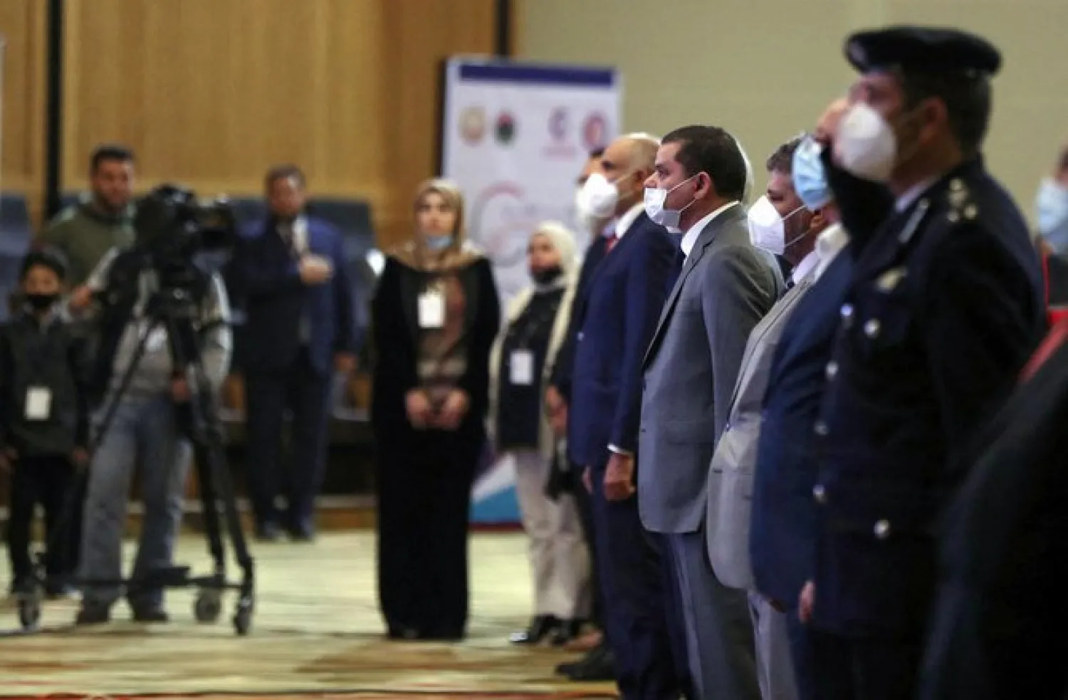 Libya's interim prime minister Abdulhamid Dbeibeh (4th R) attends a national conference on the COVID-19 pandemic, at a conference hall in the capital Tripoli, on March 13, 2021. (AFP)
