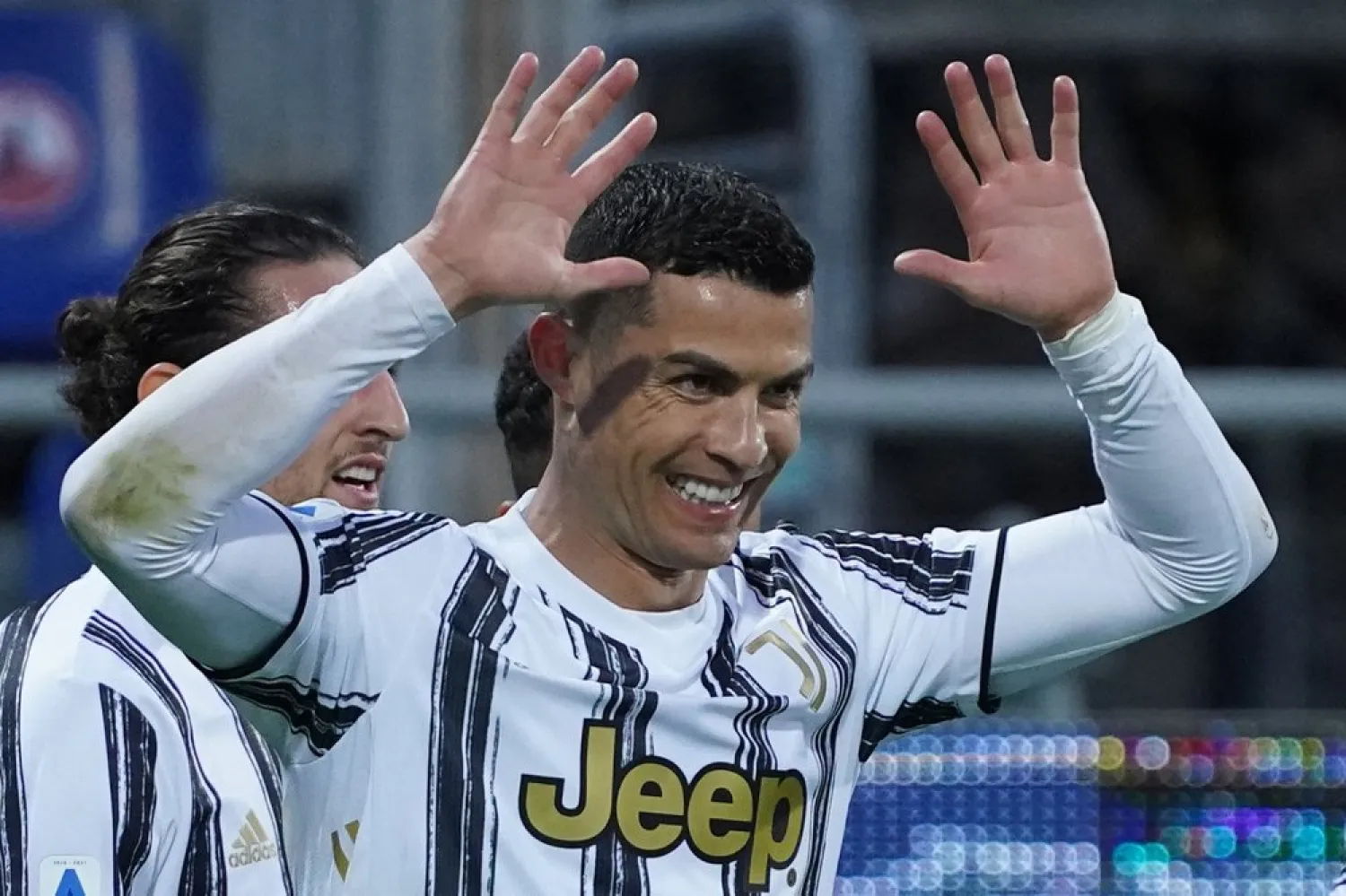 Juventus' Cristiano Ronaldo celebrates after scoring his side's third goal for his personal hat trick in 30 minutes during the match, at the Sardegna Arena stadium in Cagliari, Italy, March 14, 2021. (AP)