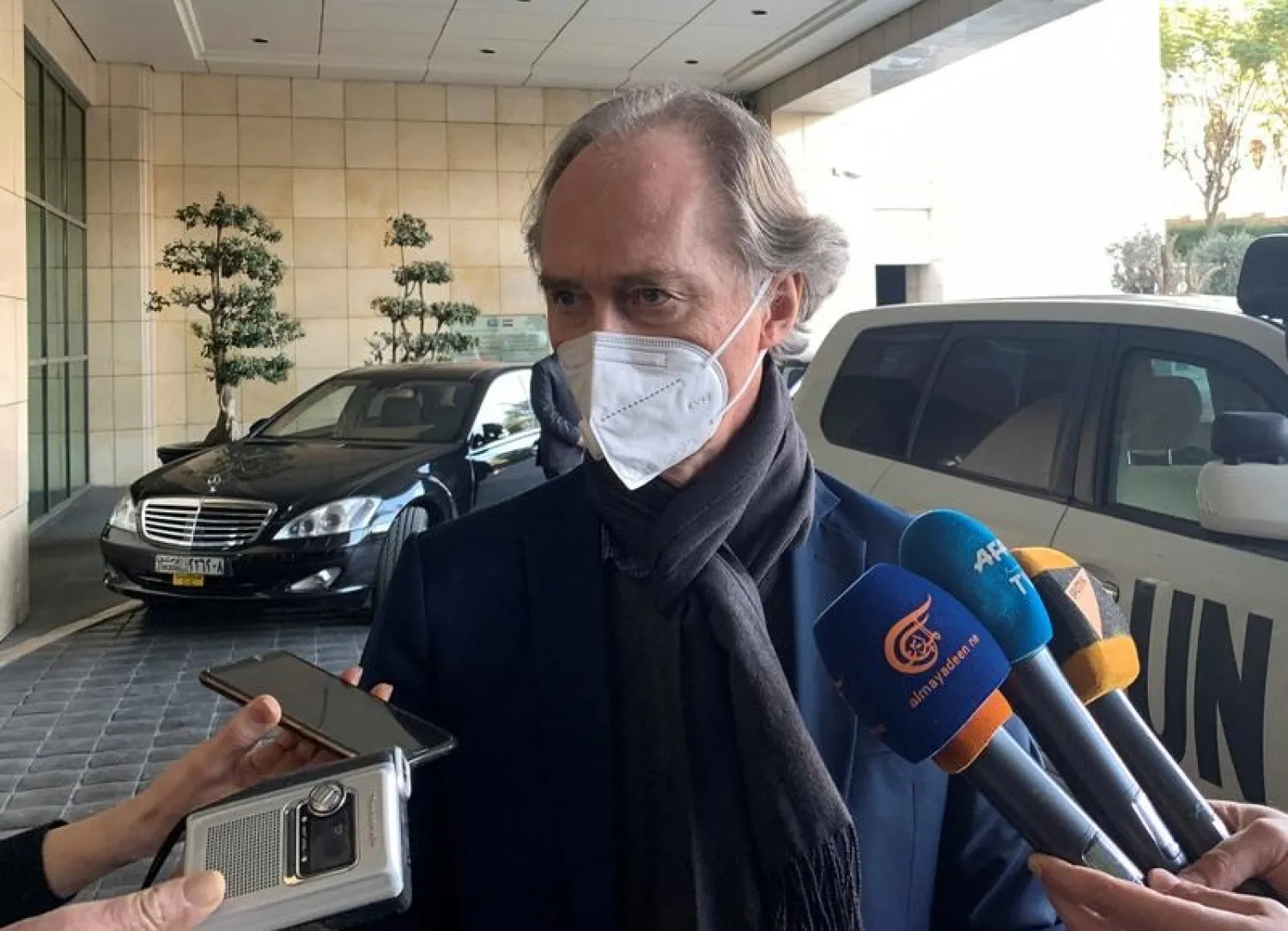 United Nations Special Envoy for Syria Geir Pedersen, wearing a protective face mask, speaks to journalists upon his arrival in Damascus, Syria February 21, 2021. (Reuters)