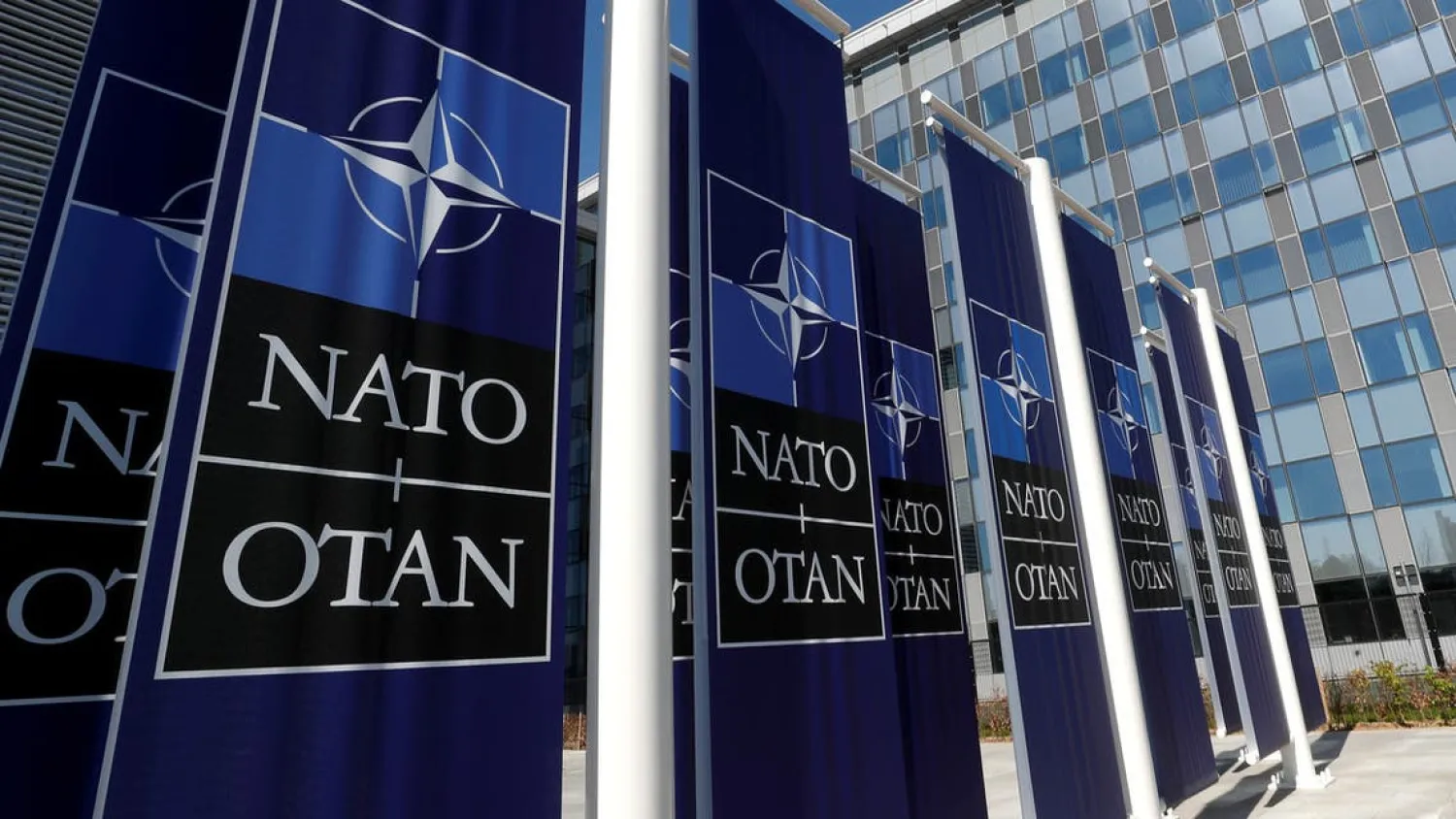 Banners displaying the NATO logo are placed at the entrance of new NATO headquarters during the move to the new building, in Brussels, Belgium April 19, 2018. (Reuters)
