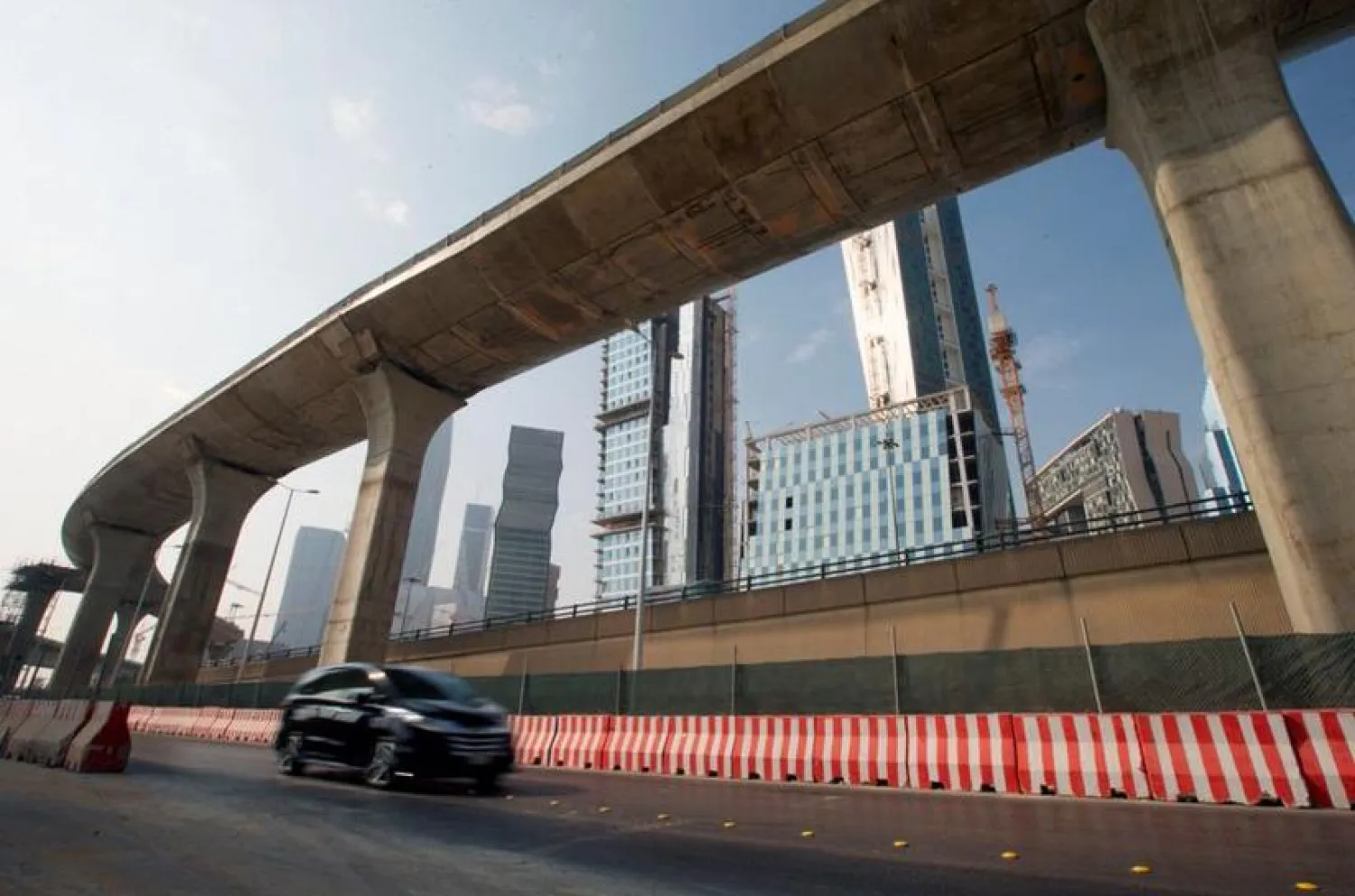 A car drives past a construction site of Riyadh Metro and the King Abdullah Financial District in Riyadh, Saudi Arabia, November 12, 2017. (Reuters)