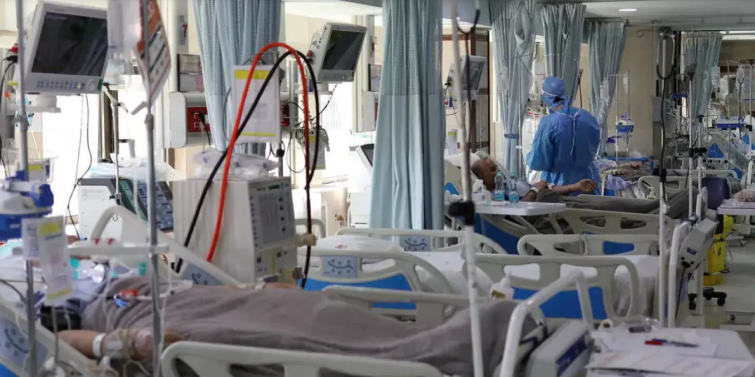COVID-19 patients lie in beds at the intensive care unit of Sasan Hospital in Tehran, Iran, on March 30, 2020. Wana News Agency, Reuters