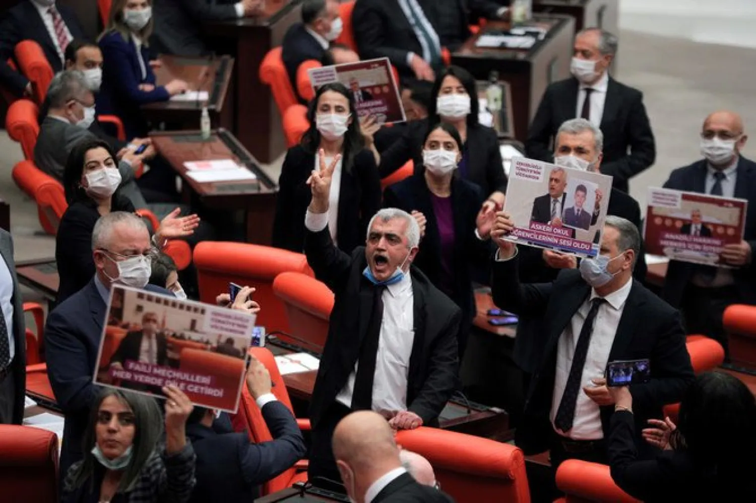 Pro-Kurdish Peoples’ Democratic Party (HDP) lawmaker Omer Gergerlioglu and party colleagues protest after the Turkish Parliament stripped him of his MP status, Ankara, Turkey, Mar. 17, 2021. (Reuters)

