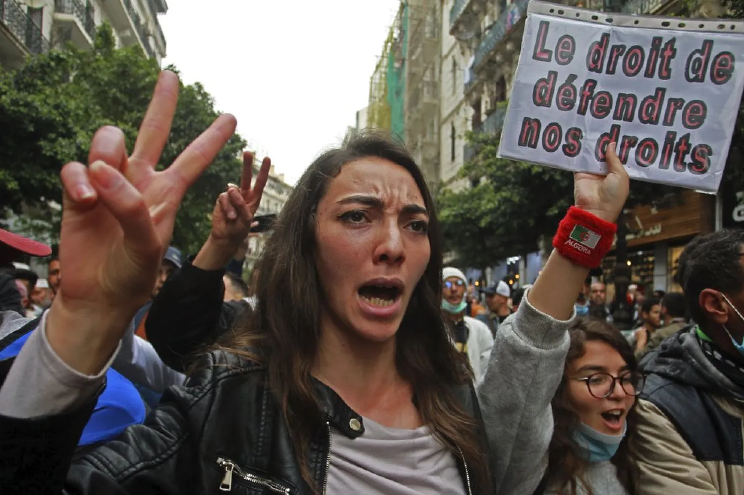 Algerian students demonstrate, one with a poster reading "The right to defend our rights" in Algiers, Tuesday, March 2, 2021. (AP)