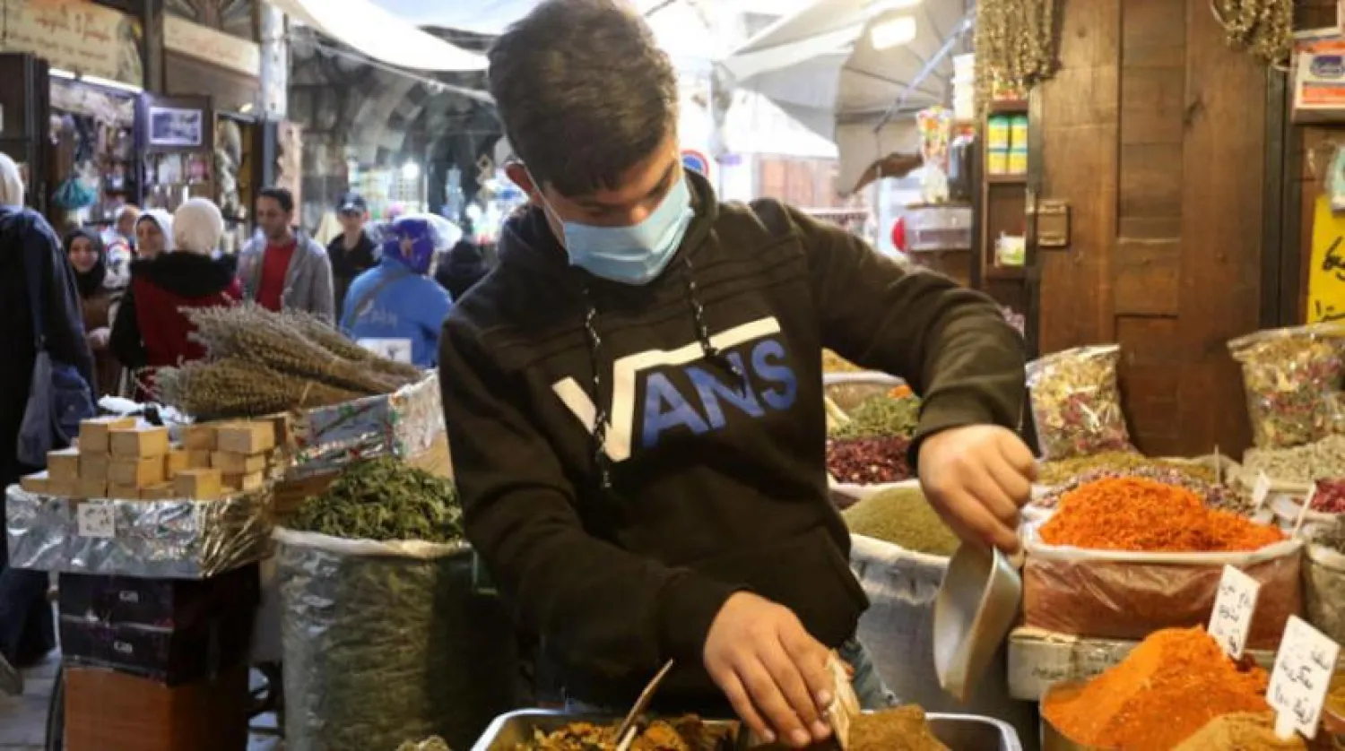 A vendor at the old market in the Syrian capital, Damascus (EPA)
