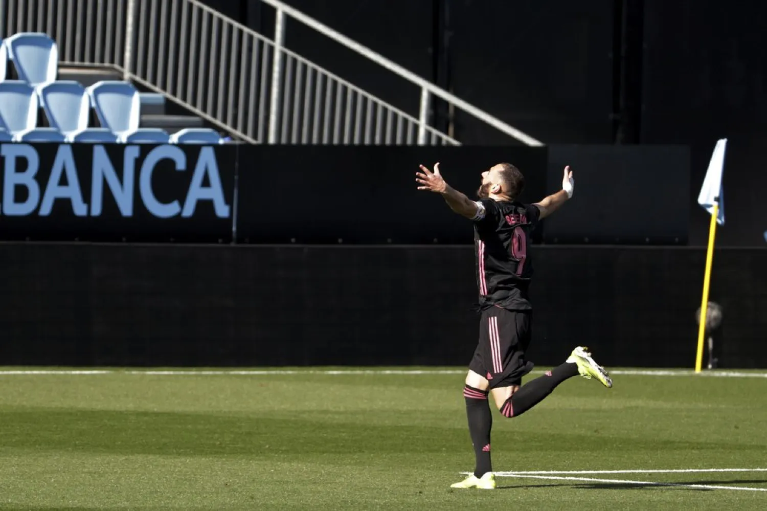 Real Madrid's Karim Benzema celebrates after scoring his side's second goal during the La Liga match against Celta Vigo at the Balaidos stadium in Vigo, Spain, March 20, 2021. (AP)