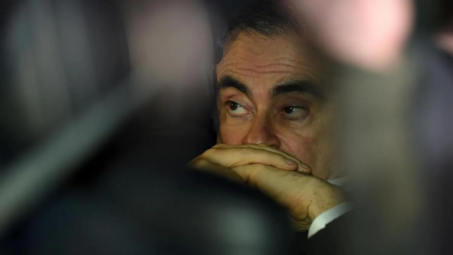 Michael Taylor and his son Peter could face jail terms of up to three years after Tokyo prosecutors charged them with illegally helping former Nissan Chairman Carlos Ghosn flee Japan. (AFP)