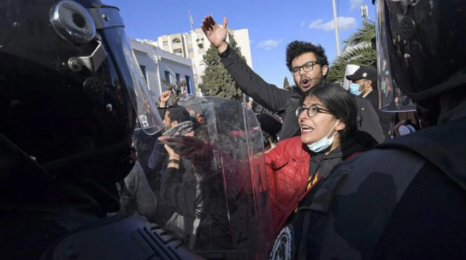 Police prevent Tunisian protesters from heading to the parliament building in Tunis during a rally on January 26. (AFP)